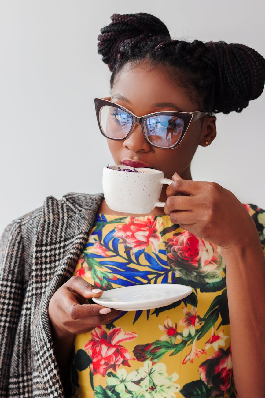 woman drinking from cup